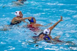 USA's Elsie Windes guarded by Spain's Maica Garcia Godoy, and USA's Maggie Steffens guarded by Spain's Andrea Blas