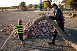 Grandpa Allen chases Andrew with the snake