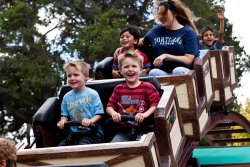 Andrew and Will riding the roller coaster at Happy Hollow 1