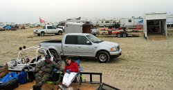 A view towards the dunes. There is literally two miles of people parked, camping and driving around