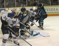 Check out the guy at the top of the crease with the puck on his stick. He didn't score.