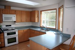 Kitchen with corian counters and cool double oven