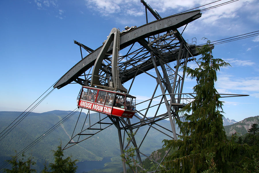 Grouse Mountain gondola swinging precariously over the tower -- note how jam packed it is