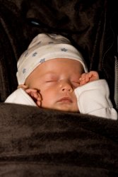 Andrew snoozing in his car seat