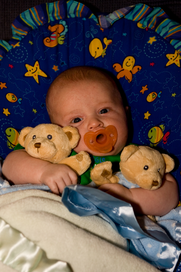 William hugging his blankie buddies