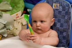 William goes cross-eyed looking at his spoon