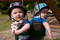 Will and Andy swinging at the park