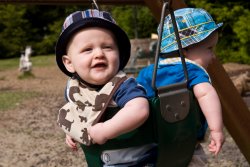 Will and Andy swinging at the park