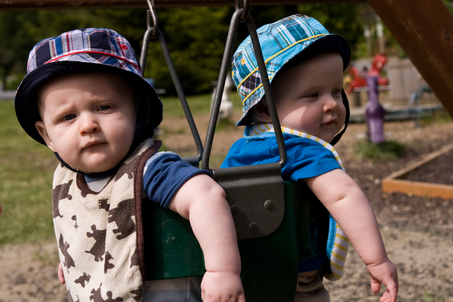 Will and Andy swinging at the park