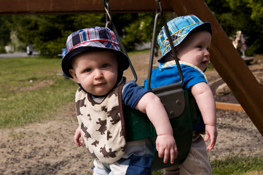 Will and Andy swinging at the park