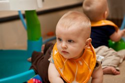 William crawls out from under the exersaucer