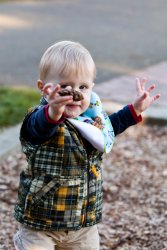 Andrew presents a pinecone