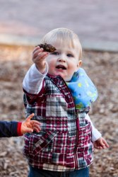 William presents a pinecone