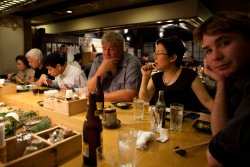 Alan and Yumi contemplate the next course as David blurs himself