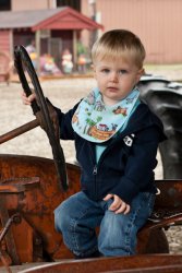 Andrew driving the tractor, complete with road rash nose