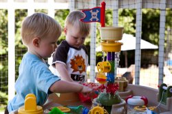 Andy and Will playing at the water table