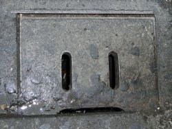 Sad sewer grate