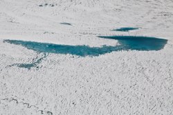 Vibrant blue-green water on a glacier