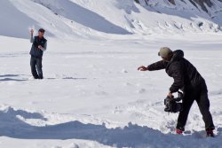 The pilot straight up caught the snowball the cameraman chucked at him