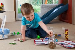 Andrew puts his gold doubloons in the Team Treasure Chest