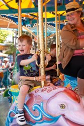 Andrew on the carousel with Jessie