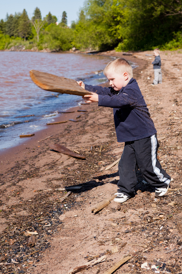 Andrew throwing driftwood