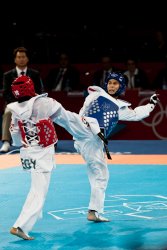 Thailand's Pen-Ek Karaket kicks Egypt's Tamer Bayoumi (2)