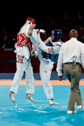 Russia's Alexey Denisenko kicks Australia's Safwan Khalil