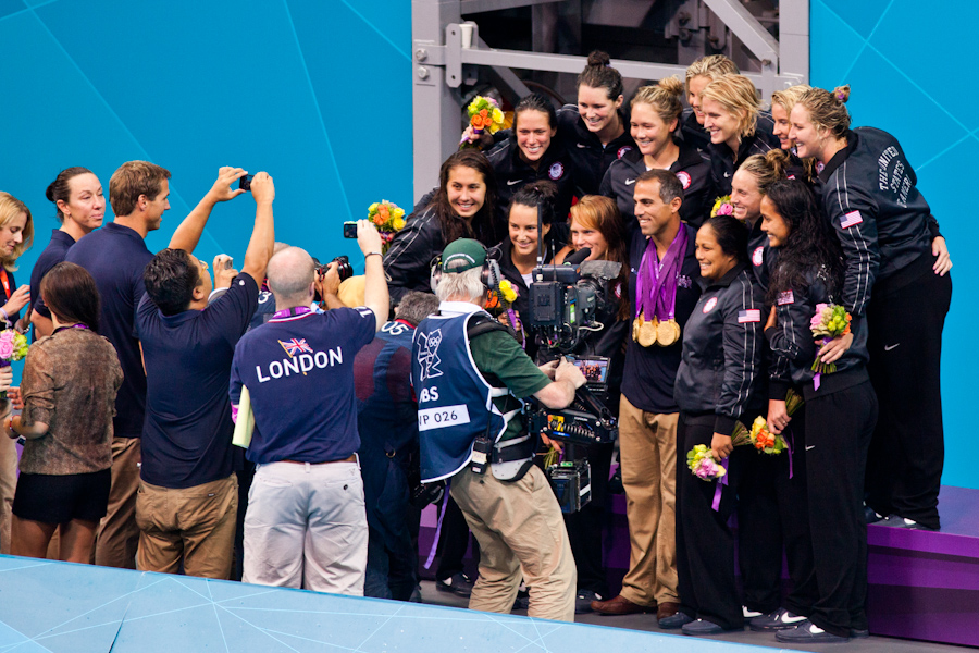 USA Women's Water Polo Adam Krikorian with all the gold medals (1)